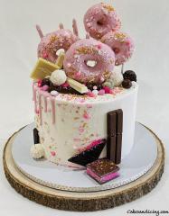 Delicious Goodness All Wrapped In One Cake Donuts , Drips,chocolates ,sprinkles And Cake !!! #donuts #donutanddripcake #whitechocolate #pinkdripcake #sugarshimmer 01
