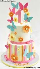 Flowers And Butterflies, Fun Colors And Whimsical Art. First Birthday Cake #buttercream #buttercreamcake #stripes #flowers #butterfly #butterflies #firstbirthdaycake #firstbirthday