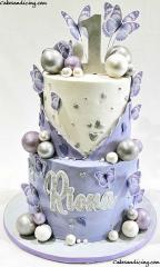 Fluttering Butterflies And Metallic Decorative Balls ,lavender, White And Silver Cake #butterfly #butterflies #butterflies Lovers #butterflys #butterflycake #lavenderbutterflycake