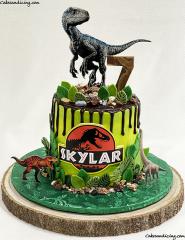 Jurassic World Dinosaur Theme Cake #dinosaur #dinosaurcake #dinosaurparty #dinosaurs #jurassicworld #jurassicpark #chocolatedripcake #fondantleaves 01