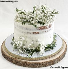 Semi Naked Cake With Fresh Rosemary And Baby’s Breath. #weddingcakes #weddingcake #seminakedcake #seminakedcakes #freshbabysbreath #freshflowers #freshrosemary #greenmacarons
