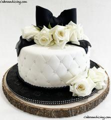 Simple And Elegant , Monochromatic Colors For A Cake #blackandwhitecake #fondantcake #diamondpatterncake #silverpearls #freshroses #fondantbow #silverrhinestone #simple #elegant
