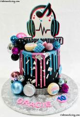Tik Tok Cake Vibrant And Striking Colors #tiktok #tiktokfan #likeforlikes #followforfollowback #trend #trending #dripcake #macarons #metallicdiscoball #candymelts #tiktoklogo