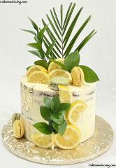 When Life Gives You Lemons, Make A Lemon Cake #lemon #lemoncake #lemons #lemonbirthdaycake #freshlemon #freshgreens #macarons #seminakedcake #seminakedcakes #goldleaves